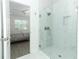 Beautiful marble shower with glass door, adjoining bedroom entrance at 4548 Dulwik Pl, Sanford, FL 32771