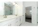 Modern bathroom with double sinks, a spacious vanity, and a walk-in glass shower at 4548 Dulwik Pl, Sanford, FL 32771