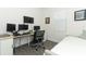 Bedroom featuring a desk, chair and wall mounted monitor. Natural light from window at 4548 Dulwik Pl, Sanford, FL 32771