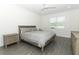 Serene bedroom with a comfortable bed, neutral decor, and ample natural light at 4548 Dulwik Pl, Sanford, FL 32771