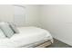 Simple bedroom with a bed, pillows, and a window providing natural light at 4548 Dulwik Pl, Sanford, FL 32771
