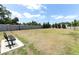 View of the community dog park area with bench seating and lush green surroundings on a sunny day at 4548 Dulwik Pl, Sanford, FL 32771