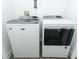Laundry room features a modern, matching washer and dryer set at 4548 Dulwik Pl, Sanford, FL 32771