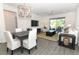 Inviting living room featuring modern furnishings and an open floor plan with sliding door access to a patio at 4548 Dulwik Pl, Sanford, FL 32771
