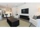 Spacious living room featuring a TV, dining area, and an open kitchen for easy interaction at 4548 Dulwik Pl, Sanford, FL 32771