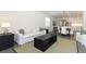 Open-concept living area with a dining space and modern decor, perfect for entertaining and relaxing at 4548 Dulwik Pl, Sanford, FL 32771