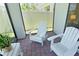 Relaxing screened patio with outdoor furniture and space for entertaining at 4548 Dulwik Pl, Sanford, FL 32771