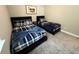 This bedroom features two beds with plaid bedding and a horse picture hanging on the wall at 4828 Abbeywood Aly, Winter Garden, FL 34787