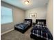 Cozy bedroom with twin beds and a window providing natural light at 4828 Abbeywood Aly, Winter Garden, FL 34787