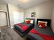 This bedroom features two beds with Disney decor, a closet, and doorway at 4828 Abbeywood Aly, Winter Garden, FL 34787
