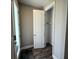 Welcoming entryway featuring a coat closet and wood-look flooring at 4828 Abbeywood Aly, Winter Garden, FL 34787