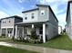 Charming two-story home with a covered porch and manicured landscaping at 4828 Abbeywood Aly, Winter Garden, FL 34787