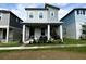 Charming two-story home with a covered porch and manicured landscaping at 4828 Abbeywood Aly, Winter Garden, FL 34787
