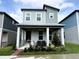 Charming two-story home with a covered porch and manicured landscaping at 4828 Abbeywood Aly, Winter Garden, FL 34787