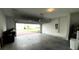Spacious two-car garage with an open door at 4828 Abbeywood Aly, Winter Garden, FL 34787