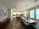 Open floor plan with kitchen offering granite countertops and stainless steel appliances adjacent to dining area at 4828 Abbeywood Aly, Winter Garden, FL 34787