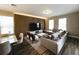 Comfortable living room with wood flooring, neutral colors, and plush seating creates inviting space at 4828 Abbeywood Aly, Winter Garden, FL 34787