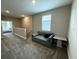 Cozy upstairs loft with a neutral sofa, carpet, and natural light creating a relaxing space at 4828 Abbeywood Aly, Winter Garden, FL 34787