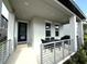 Covered patio with outdoor dining set, ideal for entertaining at 4828 Abbeywood Aly, Winter Garden, FL 34787