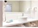 Bright and modern bathroom with round vessel sink, large mirror, and open shelving at 5245 W Irlo Bronson Memorial Hwy # 170, Kissimmee, FL 34746