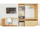 Functional and modern bedroom with desk, storage, TV, mini-fridge, safe, and microwave at 5245 W Irlo Bronson Memorial Hwy # 170, Kissimmee, FL 34746