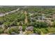 Aerial shot revealing homes surrounded by trees, highlighting the neighborhood's green landscape and proximity to the highway at 5494 Glen Oak Pl, Sanford, FL 32771