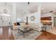Spacious living room features lots of light, gleaming wood floors, and opens into a great open floorplan at 5494 Glen Oak Pl, Sanford, FL 32771