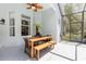 Covered patio with outdoor dining table and chairs at 5494 Glen Oak Pl, Sanford, FL 32771