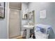 Small bathroom with a standing shower, sink, and toilet at 5501 Vance Ave, Orlando, FL 32810