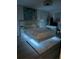 Modern bedroom features a floating bed with LED lighting and stylish decor at 5501 Vance Ave, Orlando, FL 32810