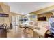 Spacious living room with a white sofa, mirrored wall, and glass doors at 5501 Vance Ave, Orlando, FL 32810