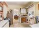 Bright home office showcases dual entryways, complemented by neutral walls and tiled flooring at 5501 Vance Ave, Orlando, FL 32810
