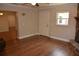 Spacious living room with wood-look floors, neutral walls, and a view of the stone fireplace at 622 Alton Rd, Winter Springs, FL 32708