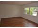 Bright living room features hardwood floors and a large window with natural light at 622 Alton Rd, Winter Springs, FL 32708