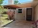 Covered patio with awning, door to the house, and outdoor lighting at 622 Alton Rd, Winter Springs, FL 32708