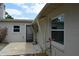 A concrete patio offers outdoor relaxation space with a nearby door and windows at 622 Alton Rd, Winter Springs, FL 32708
