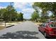 Neighborhood street view with mature trees and well-maintained houses on both sides of the road at 622 Alton Rd, Winter Springs, FL 32708