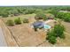 Aerial shot showcasing property with pool, spacious yard, and wooded surroundings at 6803 Round Lake Rd, Mount Dora, FL 32757