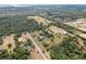 Expansive aerial view captures the property's location amidst lush green landscapes and neighboring communities at 6803 Round Lake Rd, Mount Dora, FL 32757