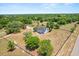 Aerial view of country home with fenced yard, offering privacy and space at 6803 Round Lake Rd, Mount Dora, FL 32757