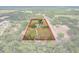 Aerial view of property with outlined land, surrounded by lush greenery and neighboring homes at 6803 Round Lake Rd, Mount Dora, FL 32757