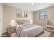 Cozy bedroom with modern décor, soft rug, and comfortable bedding at 6803 Round Lake Rd, Mount Dora, FL 32757