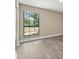Bright bedroom filled with natural light shining through a window at 6803 Round Lake Rd, Mount Dora, FL 32757