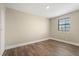 Unfurnished bedroom featuring warm wood floors and natural light at 6803 Round Lake Rd, Mount Dora, FL 32757