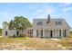 Inviting home featuring a covered porch and classic architectural details at 6803 Round Lake Rd, Mount Dora, FL 32757