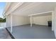 Spacious white garage with ample room for parking and storage at 6803 Round Lake Rd, Mount Dora, FL 32757