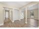 Hallway features plank flooring, neutral walls, and stairs at 6803 Round Lake Rd, Mount Dora, FL 32757