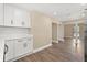 Bright kitchenette with new cabinets and plank flooring at 6803 Round Lake Rd, Mount Dora, FL 32757