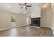 Bright living room featuring plank floors and a modern fireplace at 6803 Round Lake Rd, Mount Dora, FL 32757