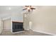 Bright living room features a fireplace and plank flooring at 6803 Round Lake Rd, Mount Dora, FL 32757